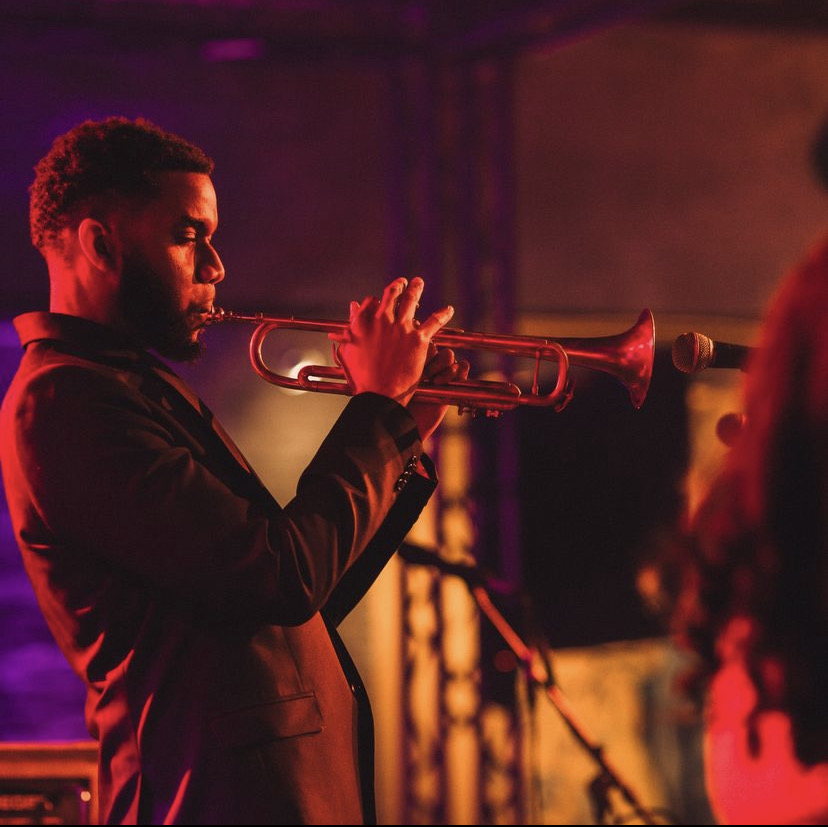 Jelani Akil Bauman performing with trumpet